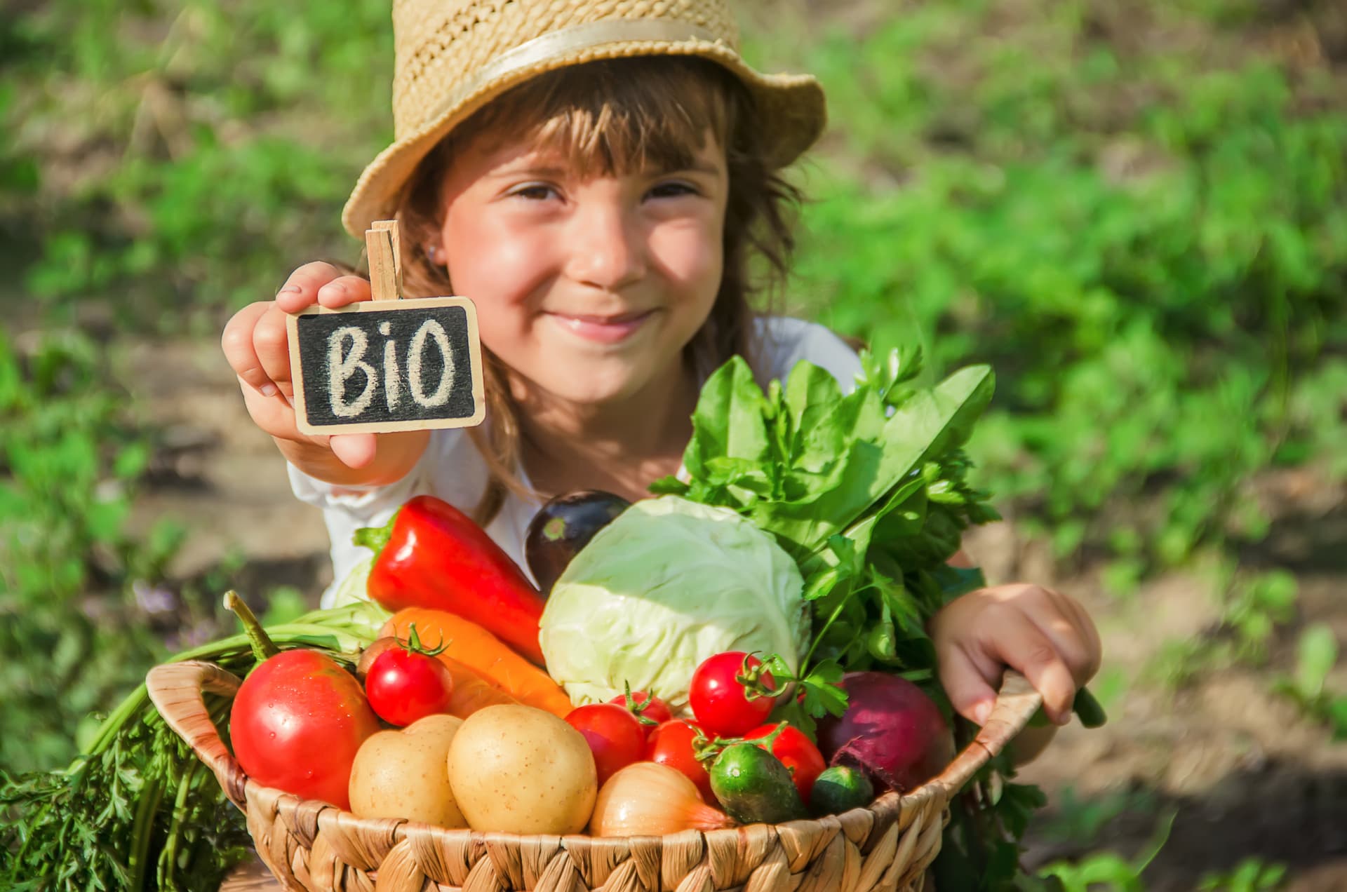 Child with fresh vegetables